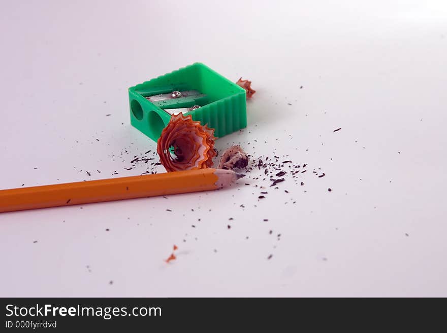 Pencil sharpener, pencil and debris. Pencil sharpener, pencil and debris.