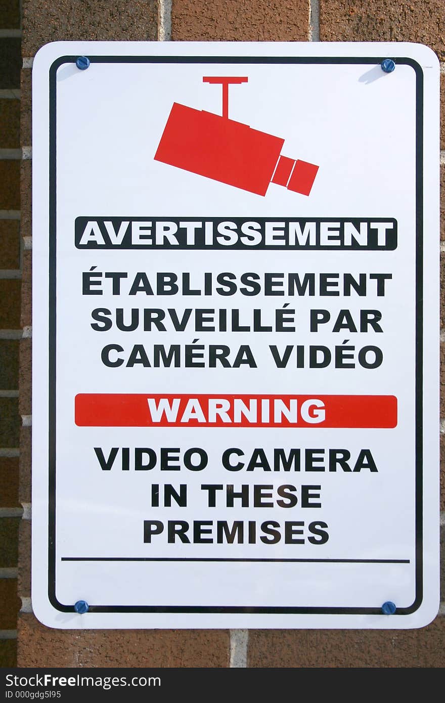 Bilingual video camera sign. Bilingual video camera sign