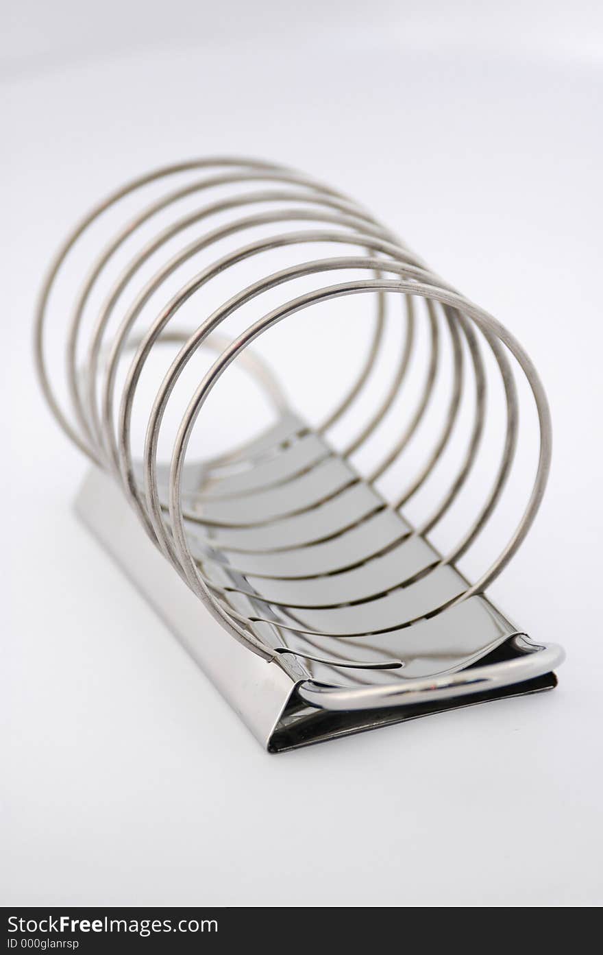 Metallic toast rack on white background. Metallic toast rack on white background