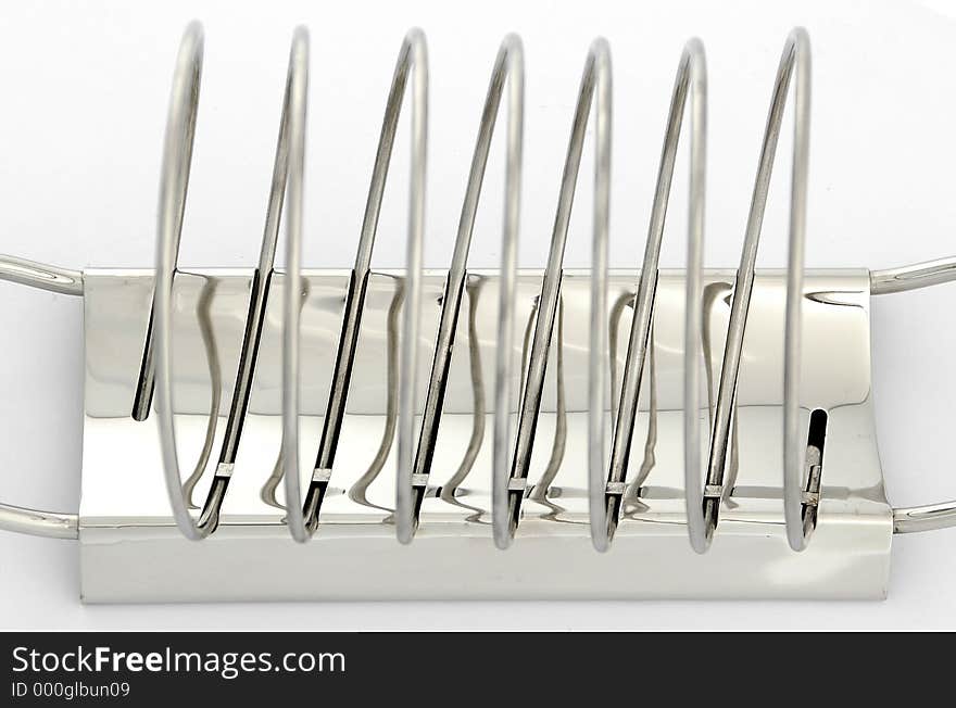 Metallic toast rack on white background. Metallic toast rack on white background