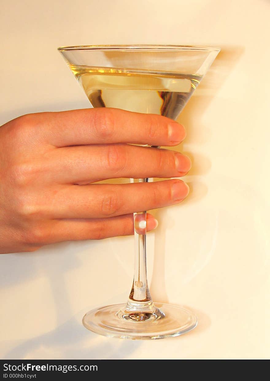 One hand keeping a glass of champagne