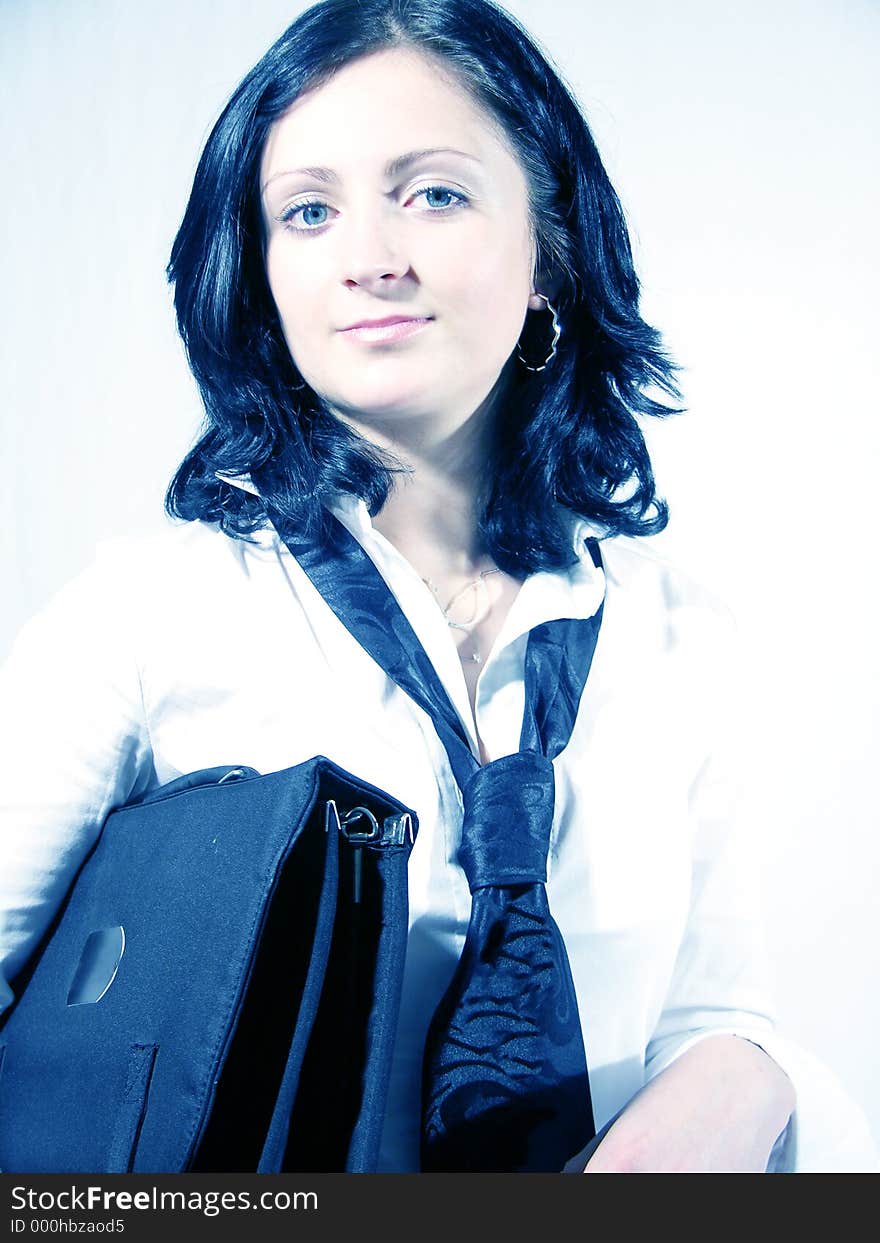 Young business woman carrying a briefcase. Young business woman carrying a briefcase.