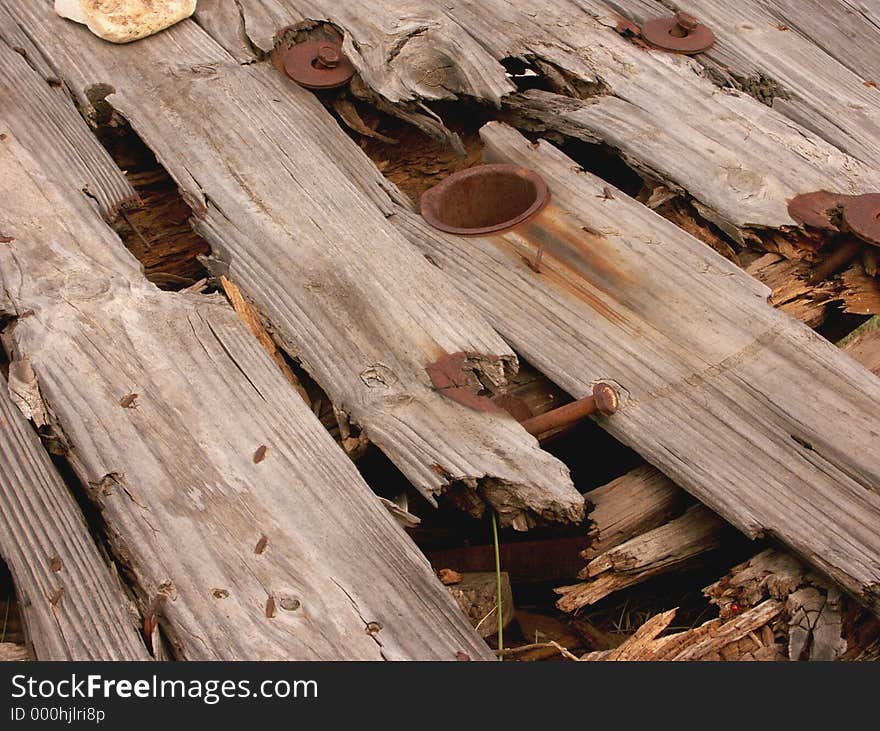 Wooden spool rotten and falling apart. Wooden spool rotten and falling apart