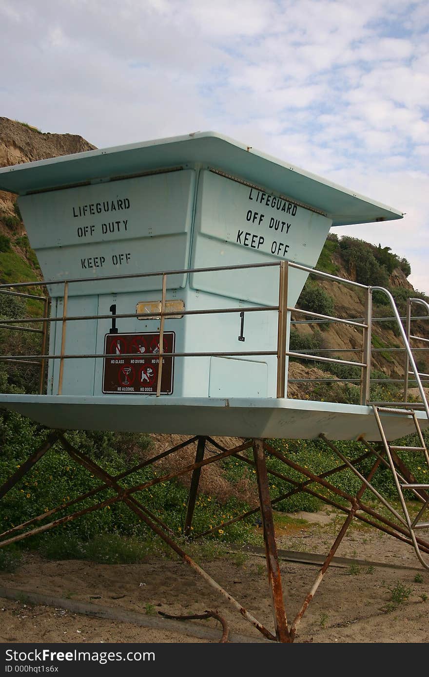 A lifeguard tower in the sand on a southern Cal. beach