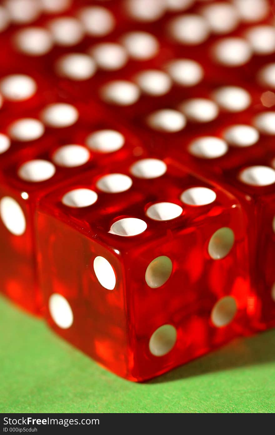 Macro shot of dices lined up on a green table. Macro shot of dices lined up on a green table