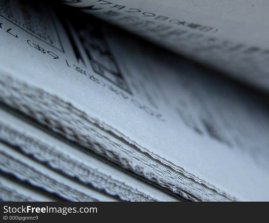 A stack of Japanese newspapers.