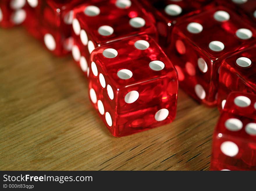 Close-up of dice on a wooden table. Close-up of dice on a wooden table