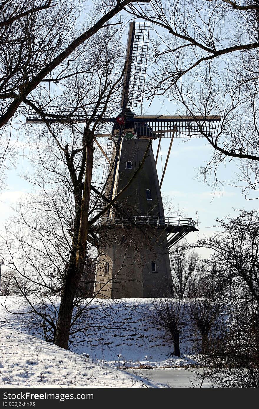 Old dutch windmill(grain/corn) at Woudrichem, called : De Nooitgedagt. Old dutch windmill(grain/corn) at Woudrichem, called : De Nooitgedagt.