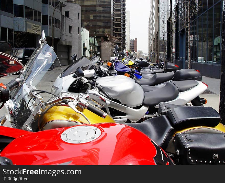 A row of colorful motorcycles in Montreal. A row of colorful motorcycles in Montreal