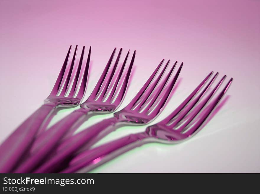 Macro of glowing purple forks