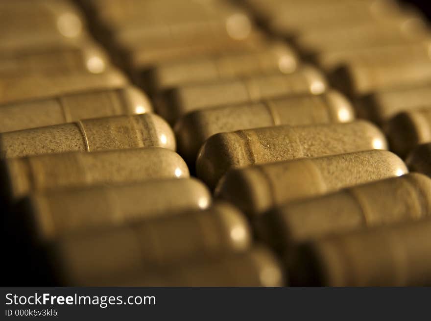 A close-up of capsules lined up in rows