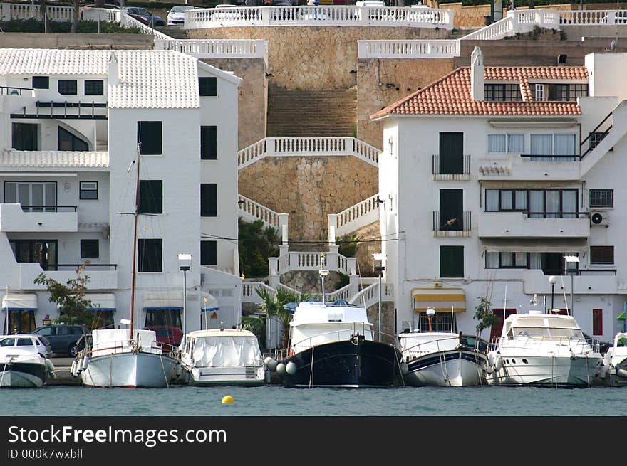 Houses and boats on the harbour front. Houses and boats on the harbour front