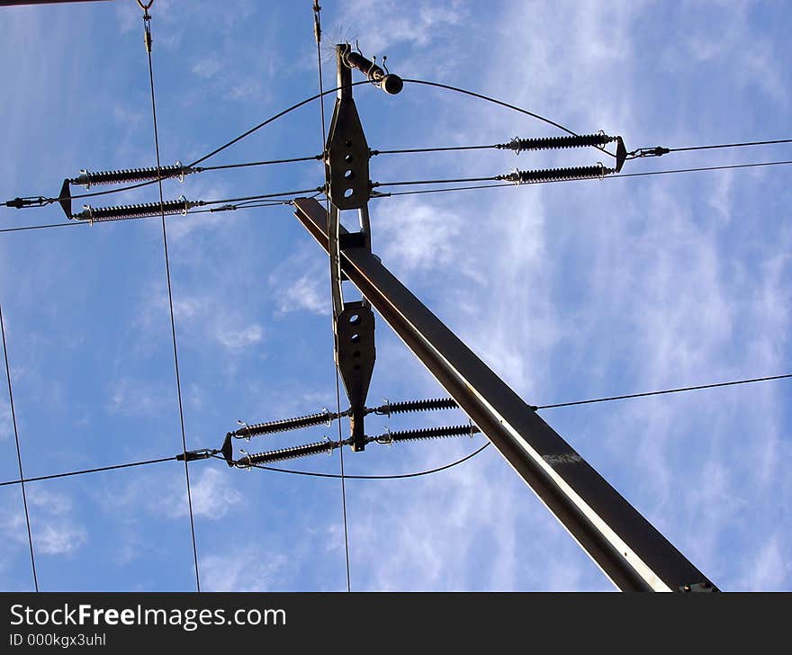 Typical industrial setting: power lines on blue sky. Typical industrial setting: power lines on blue sky