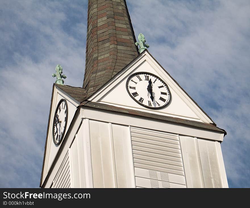 This is a shot of the steeple and a clock of an old wooden church located in Englishtown, NJ. This is a shot of the steeple and a clock of an old wooden church located in Englishtown, NJ.