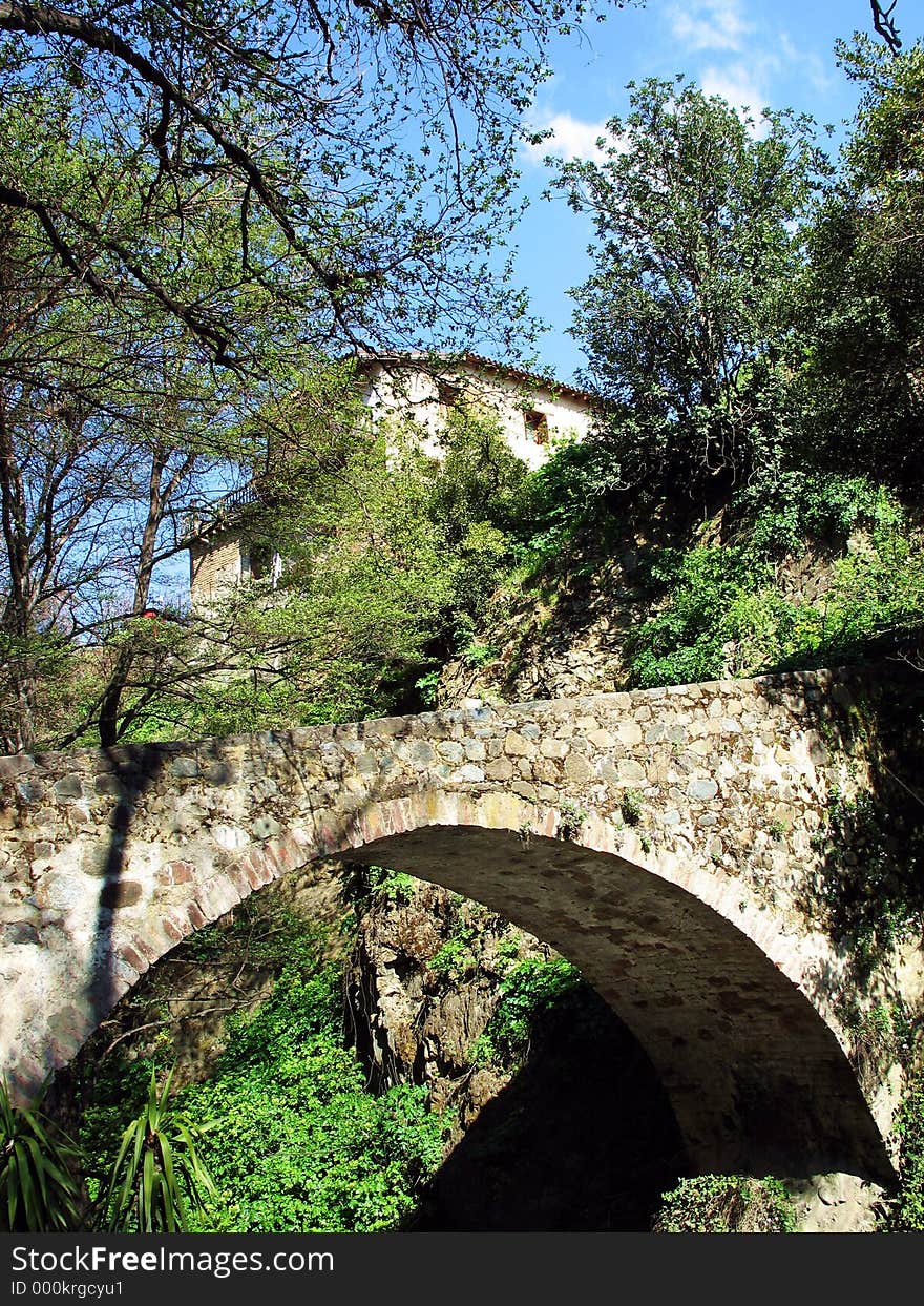 An old stone bridge and a house. Kakopetria, Cyprus. An old stone bridge and a house. Kakopetria, Cyprus