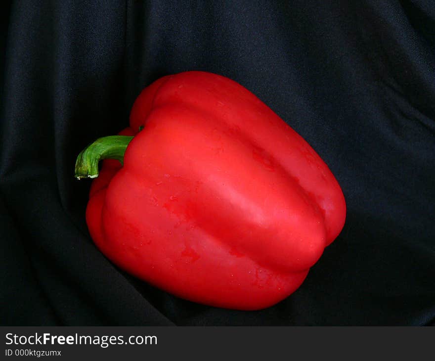 Isolation of red bell pepper on black