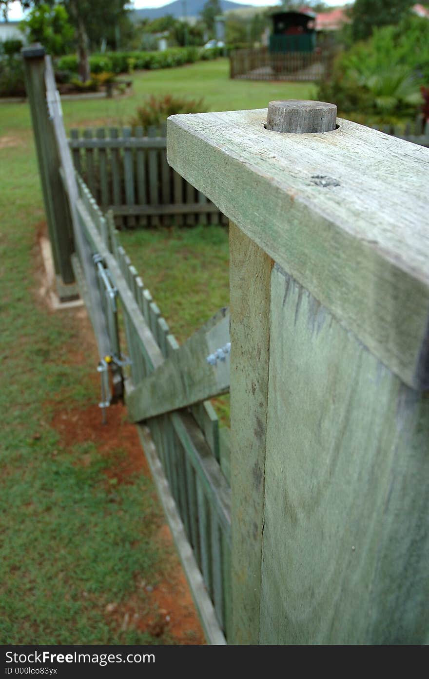 Looking along a vintage style hardwood gate. Looking along a vintage style hardwood gate.