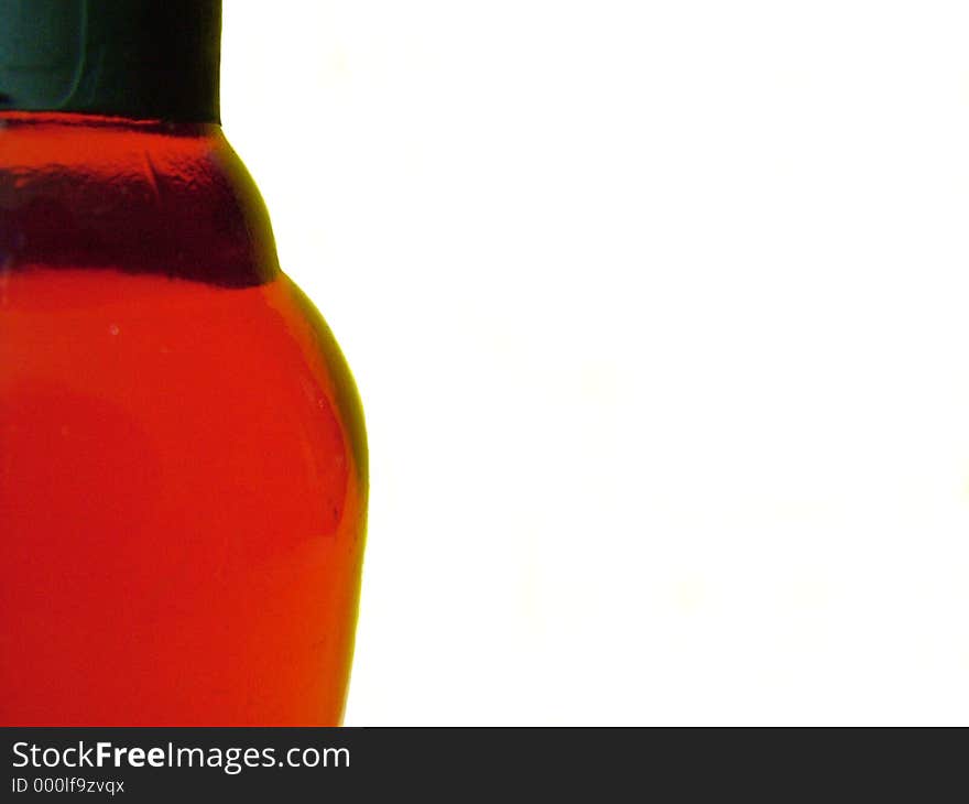 Close up of bottle of red wine against white background. Close up of bottle of red wine against white background