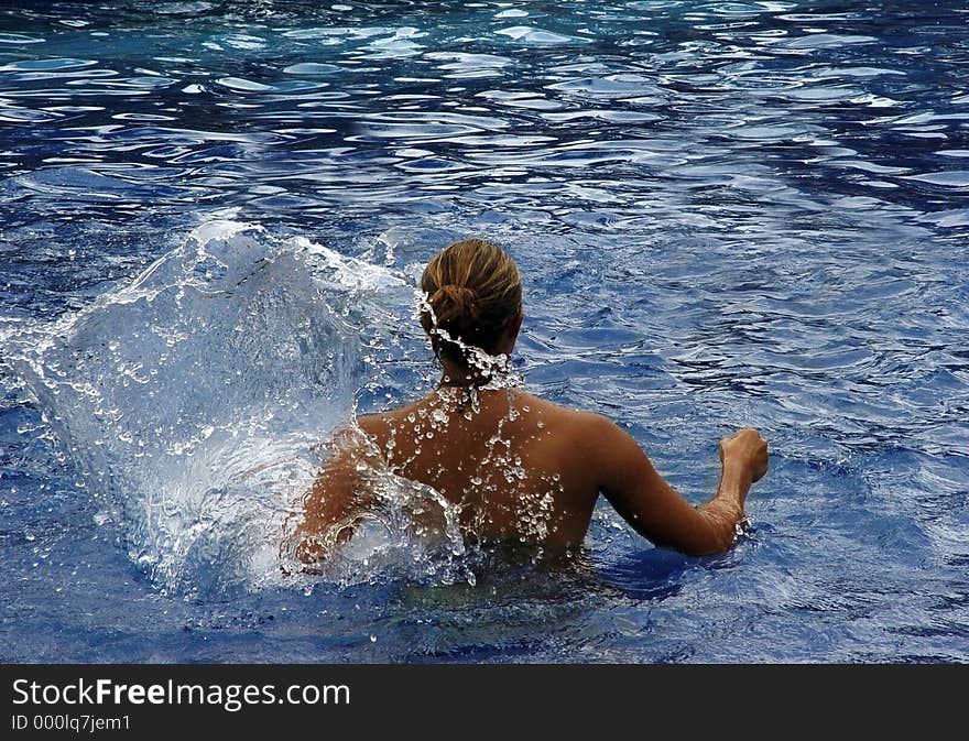 Woman in a swimming pool. Woman in a swimming pool