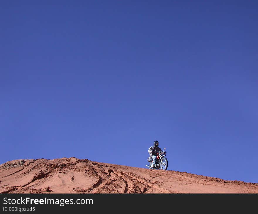 Heading downhill on a classic dualsport. Heading downhill on a classic dualsport.