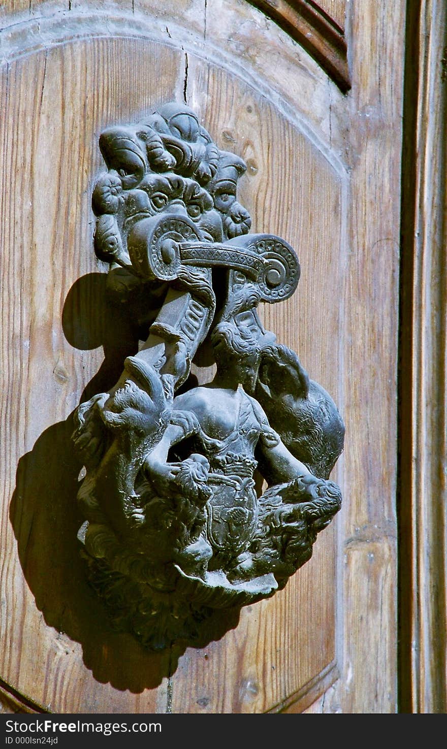 Old door knocker with woman figure, lions and some coat of arms, Malta. Old door knocker with woman figure, lions and some coat of arms, Malta