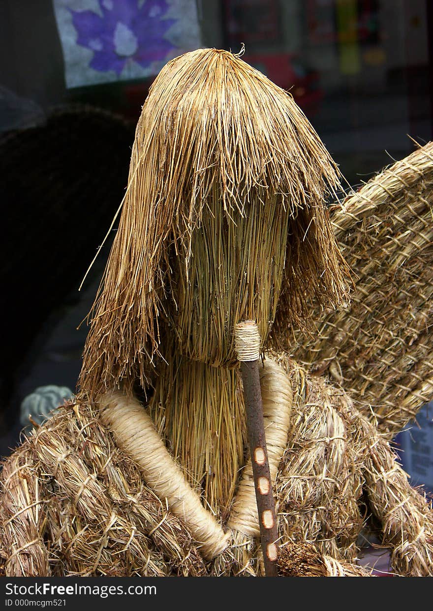 Straw angel with a flute