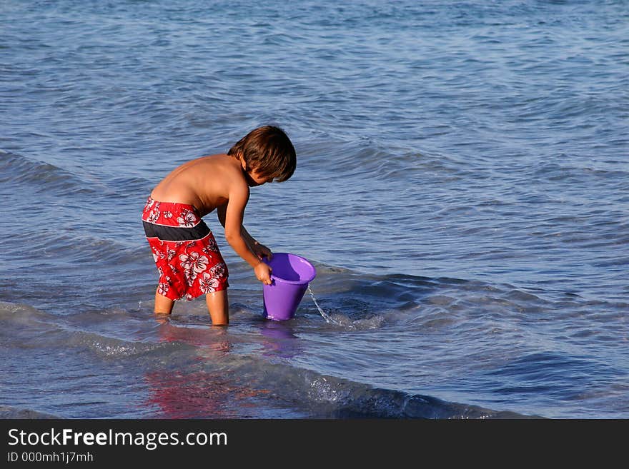 Boy playing on the beach.