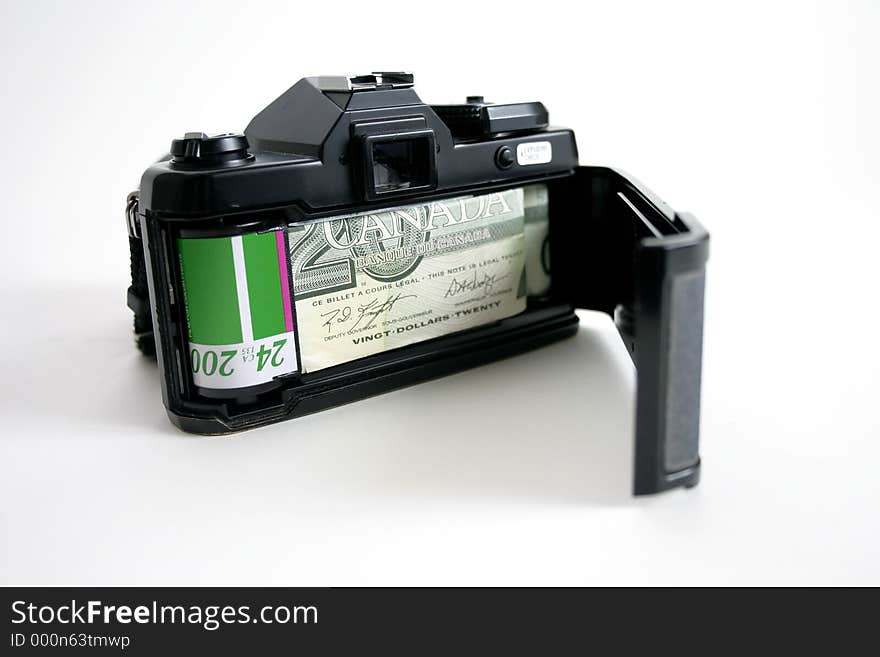 35mm camera with money representing film. 2 rolls of 'money' film. 35mm camera with money representing film. 2 rolls of 'money' film