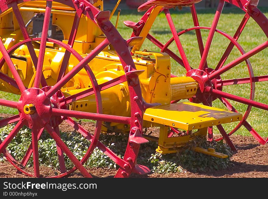 Antique Tractor with all metal wheels. Partial View