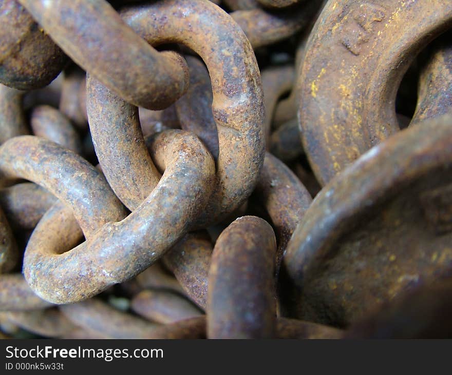 Photo of some old, weathered, rusty old industrial chain. Photo of some old, weathered, rusty old industrial chain.