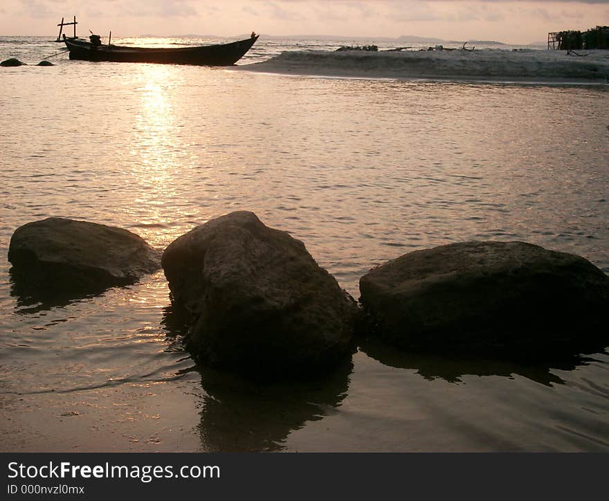 Silhouettes of rocks and boat. Silhouettes of rocks and boat
