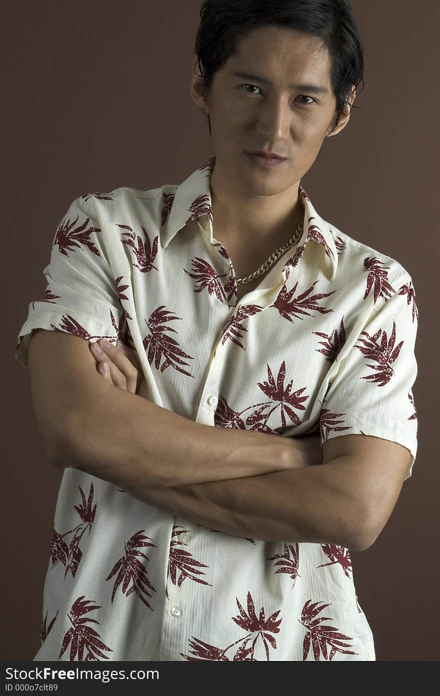 A well-built asian model in a casual shirt. A well-built asian model in a casual shirt