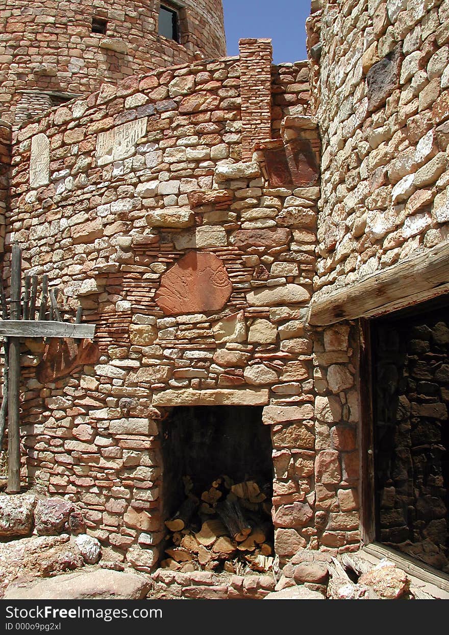 Architectural detail at the base of The Watchtower in Arizona along the rim of the canyon. Ancient builders used the high tower to see long distances. Stone glyphs are found throughout the rock structure.