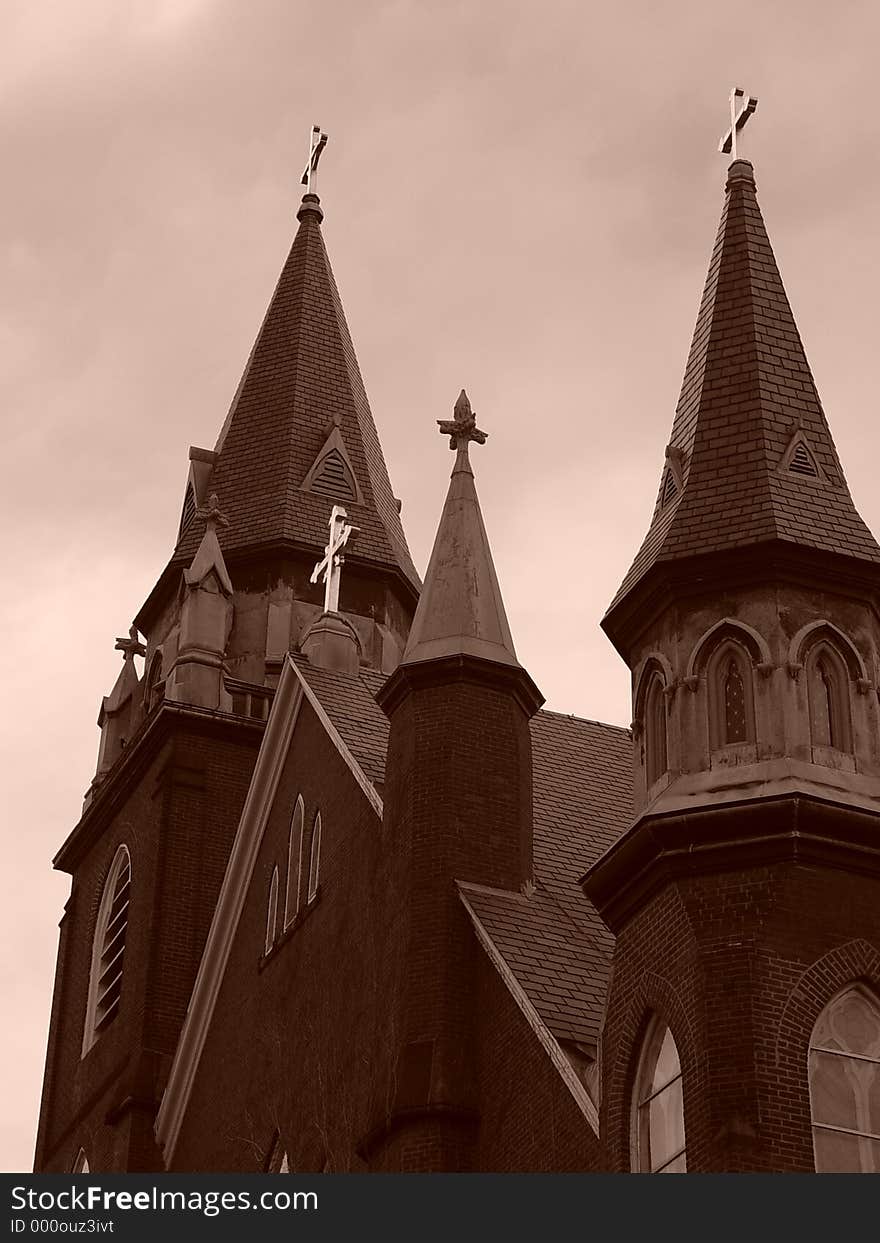 Sun glinting off the golden crosses on top of church in easthampton, massachusetts