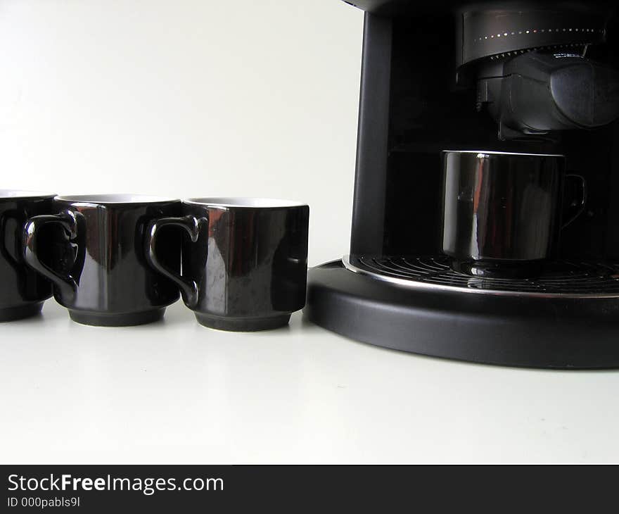 Cups in line, wainting their turn to get some coffee. Cups in line, wainting their turn to get some coffee.