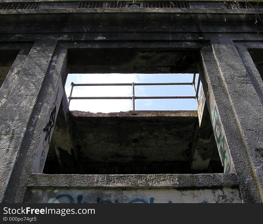 Looking up through a window at a railing on what I believe was the roof of this old building. Part of the ruins of the old Western Washington State Mental Hospital in Steilacoom, WA. Looking up through a window at a railing on what I believe was the roof of this old building. Part of the ruins of the old Western Washington State Mental Hospital in Steilacoom, WA.