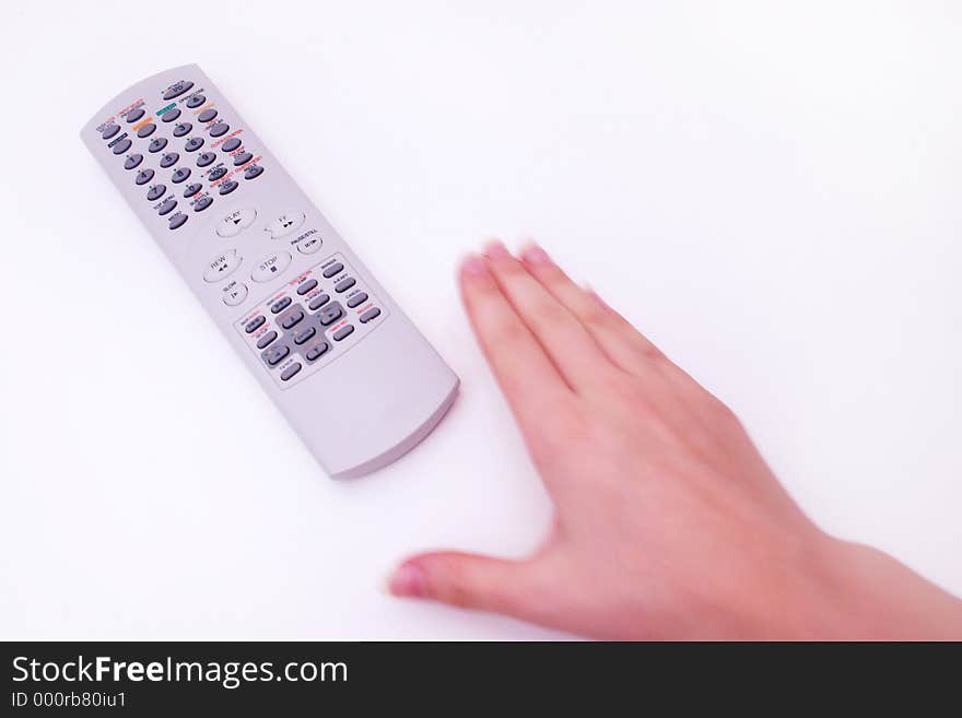 Hand reaching for television remote. Hand reaching for television remote