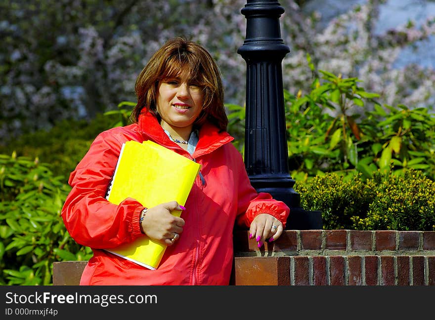 Young Woman Holding a Folder. Young Woman Holding a Folder.