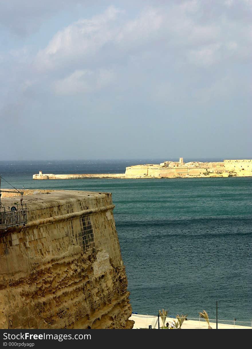 The bastions surrounding Valletta, Malta's capital, the breakwater, the natural port of the Grand Harbour and its coastal waters. The bastions surrounding Valletta, Malta's capital, the breakwater, the natural port of the Grand Harbour and its coastal waters.