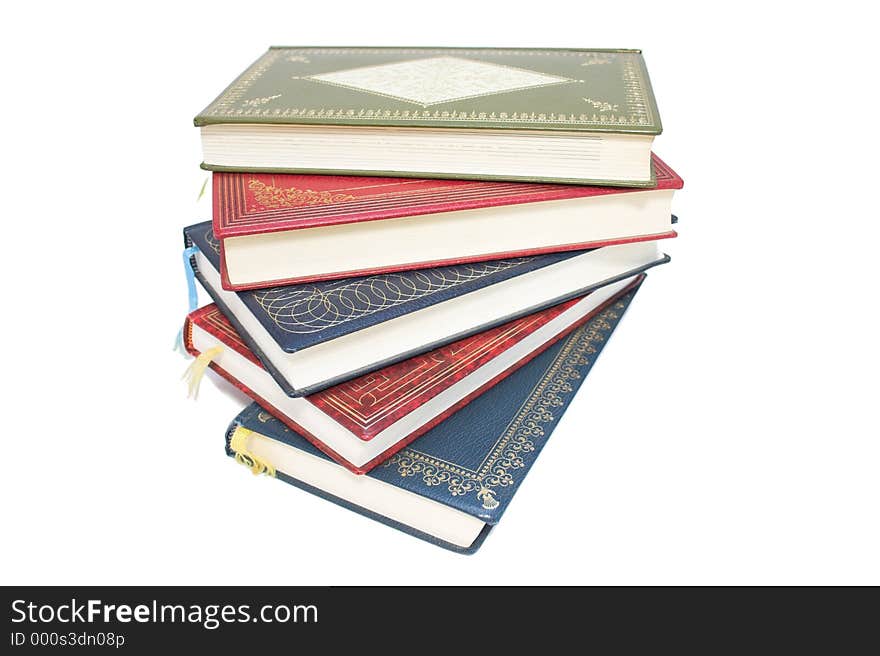 Stack of colourful old books - white background