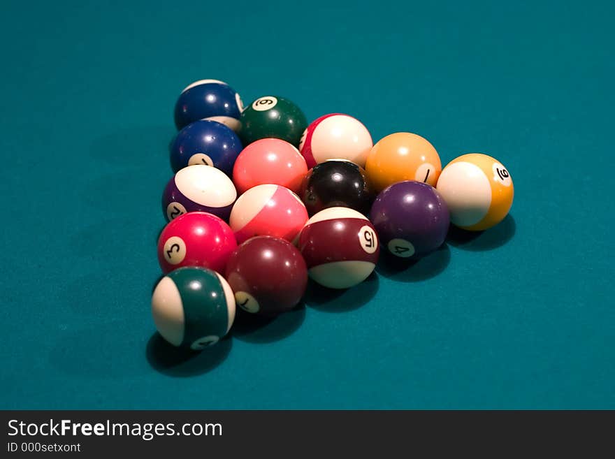 Pool balls arranged in a triangle