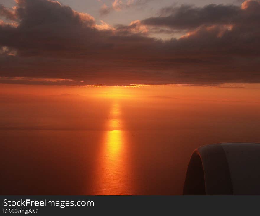 Sunset behind the clouds on my climb out of Istanbul. Reflexion on the Sea of Marmara. Sunset behind the clouds on my climb out of Istanbul. Reflexion on the Sea of Marmara.