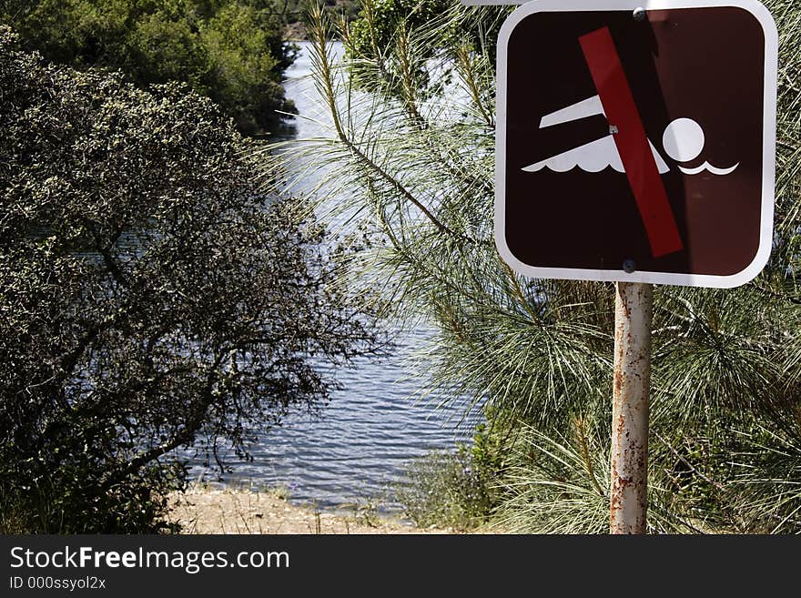 No swimming sign near lake