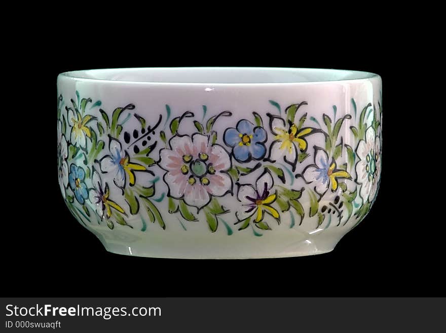 Small cup with flower dawings over black