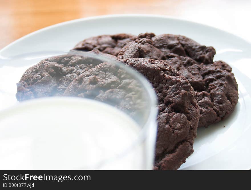 Chocolate chip cookies & a glass of ice cold milk. Chocolate chip cookies & a glass of ice cold milk