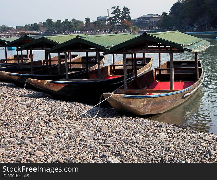 Some traditional boats on the riverside in a touristic area from Kyoto,Japan