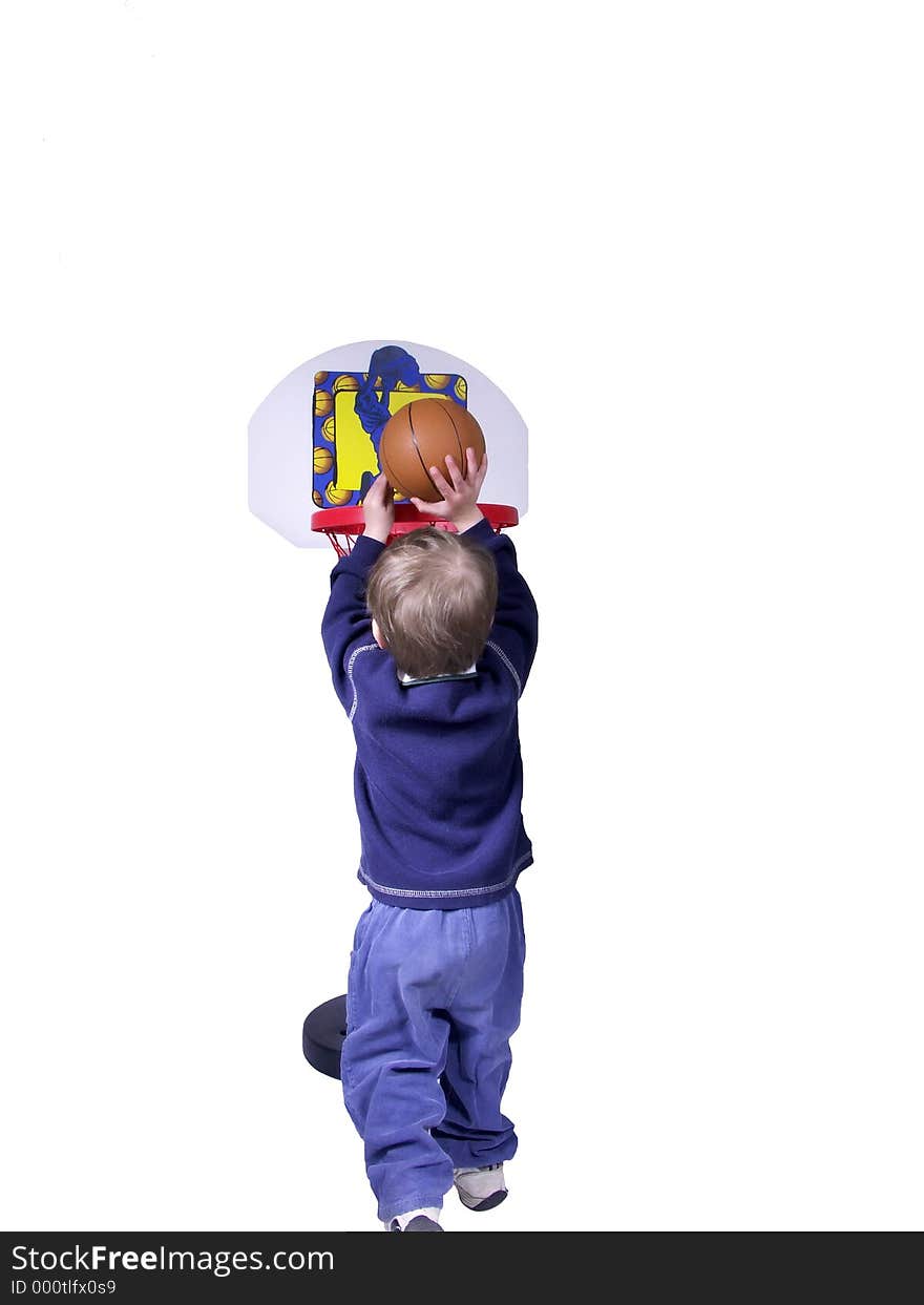 Toddler boy playing basket ball. Toddler boy playing basket ball