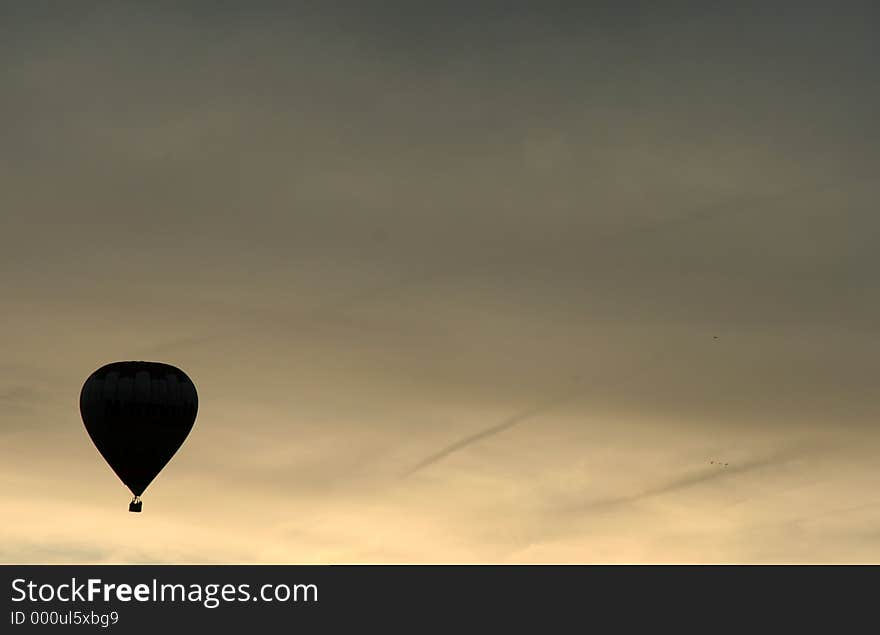 Silhouette of a hot air balloon at sunset