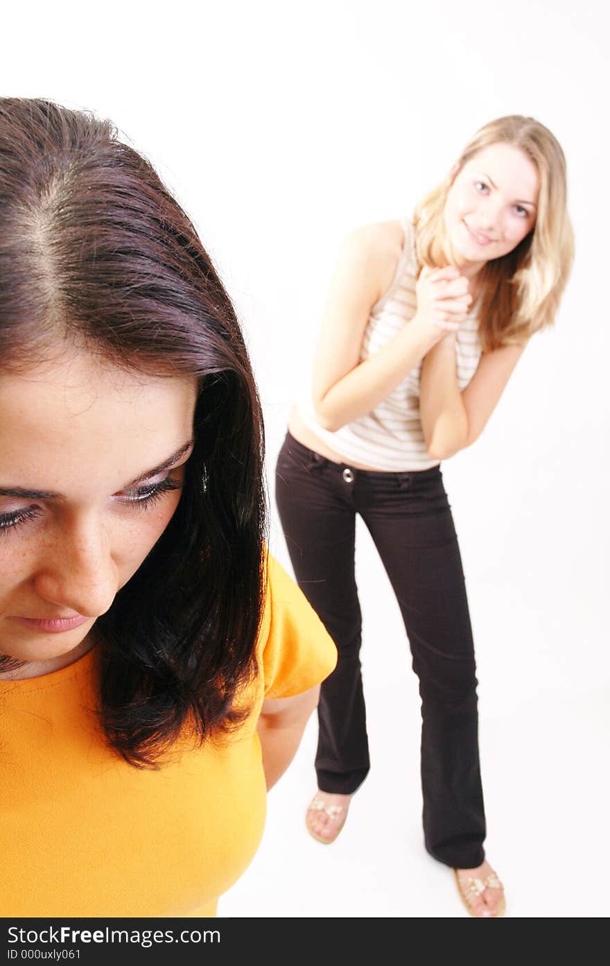 Two girls in portrait, one begging for front position. Two girls in portrait, one begging for front position