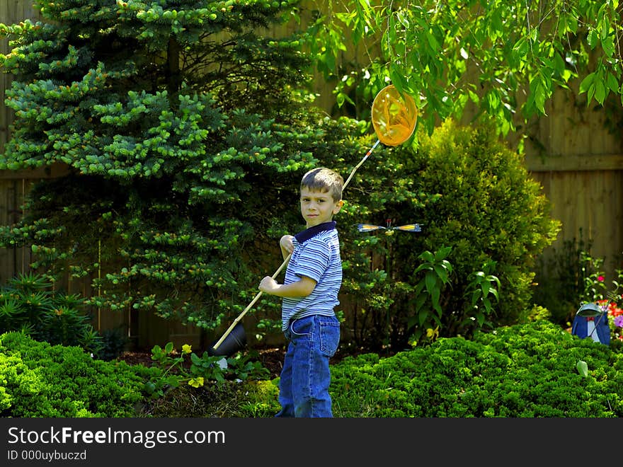 Young Boy Outside With Bug Net. Young Boy Outside With Bug Net